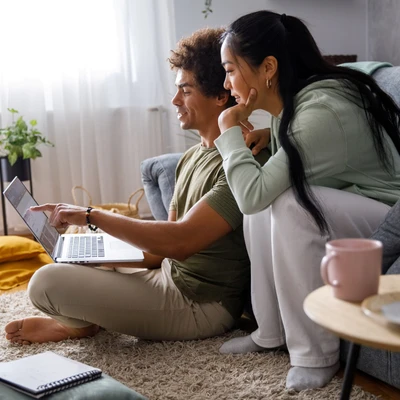 Couple Looking At Computer
