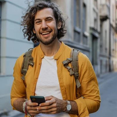 Man Looking At Camera With Phone