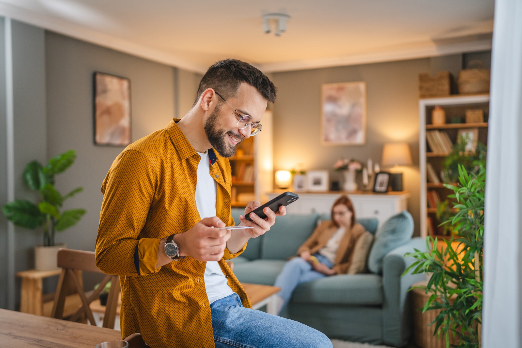 Man With Phone On Table