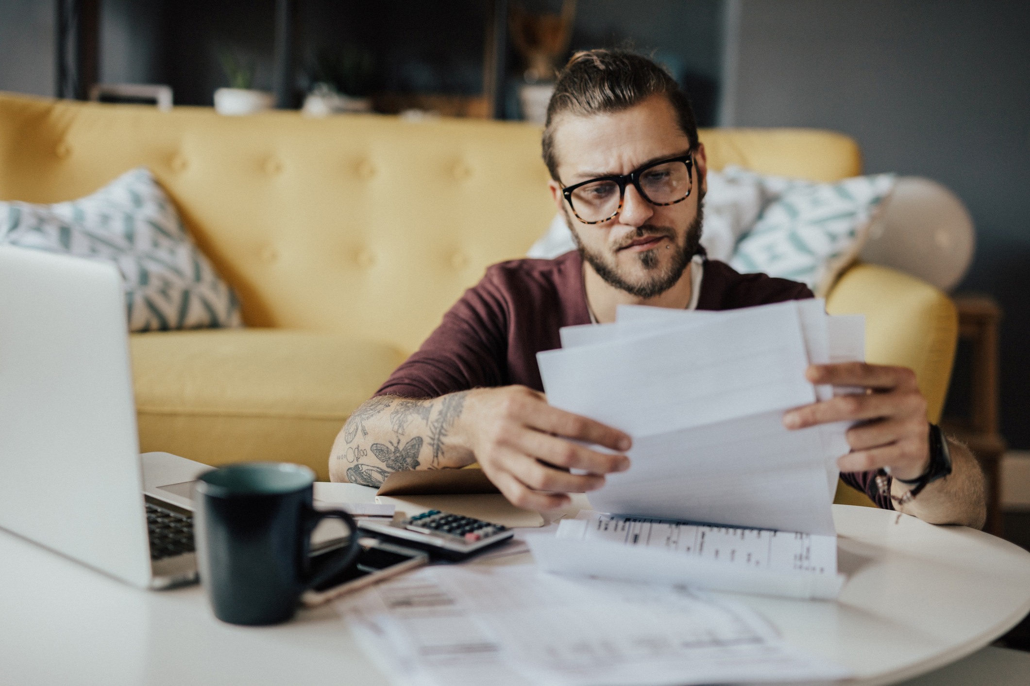 Man Looking At Papers