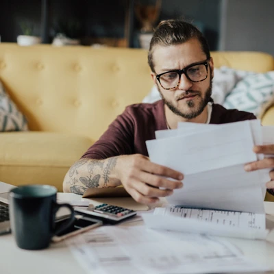 Man Looking At Papers